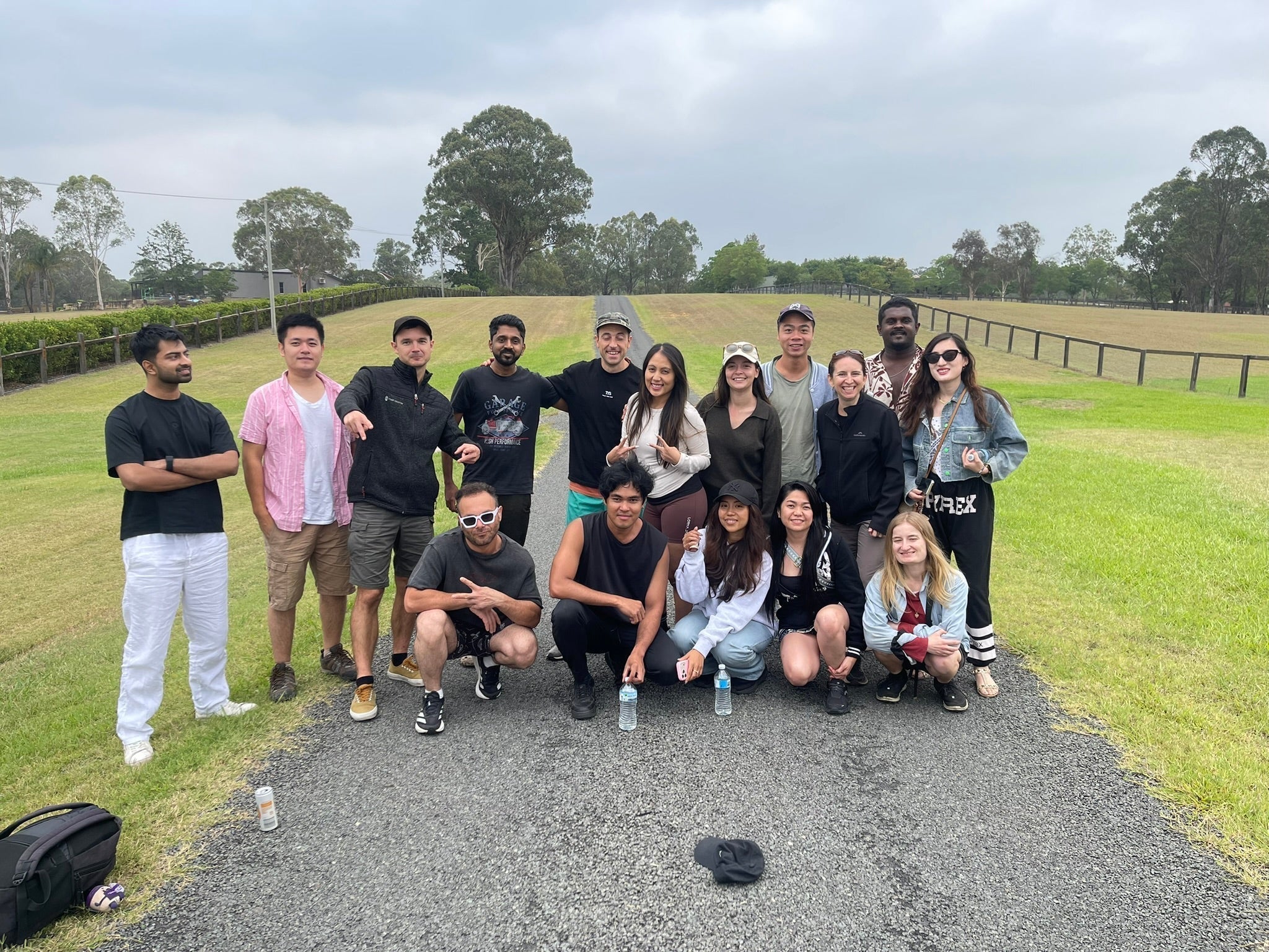 Camp Escape group enjoying a camping trip with friends at Cattai Campground in NSW, gathering outdoors before a weekend of riverside camping, BBQs and exploring nature.